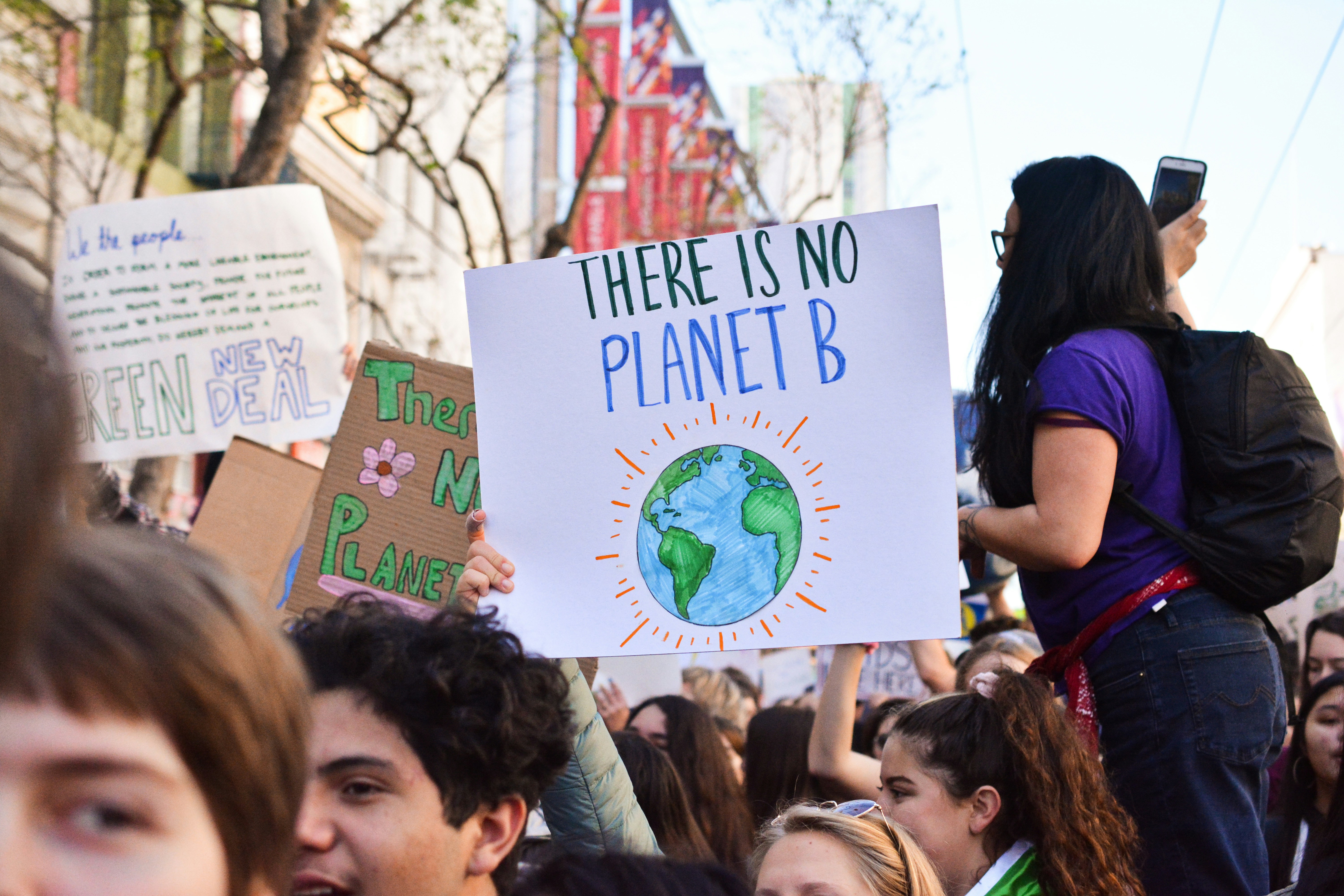 Photo by Li-An Lim on Unsplash. Image of climate change protesters